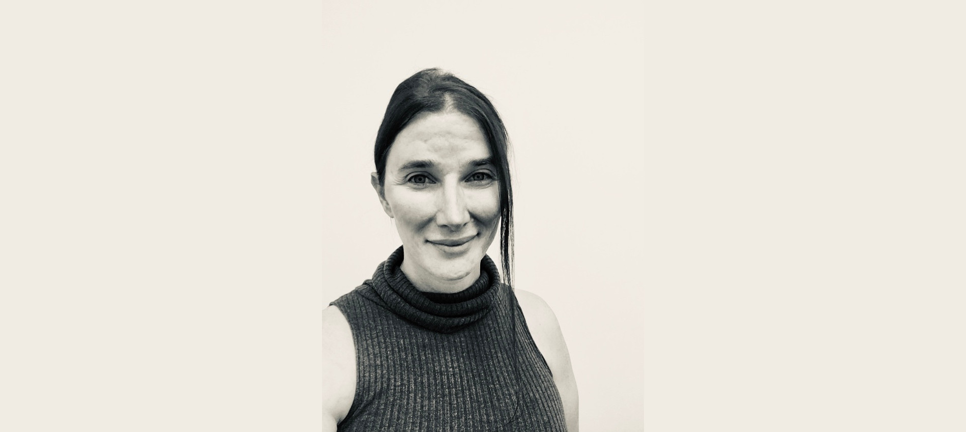 Kim White, Senior Occupational Therapy Practitioner - a head and shoulders black and white photograph of a smiling woman